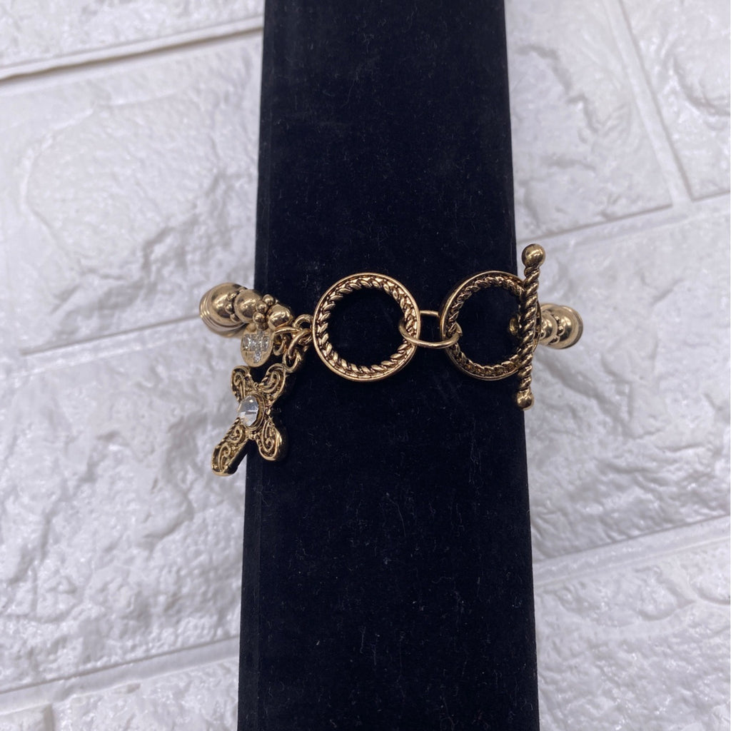 Gold Tone Cross Charm Stretch Bracelet With Toggle & Rhinestone Accents