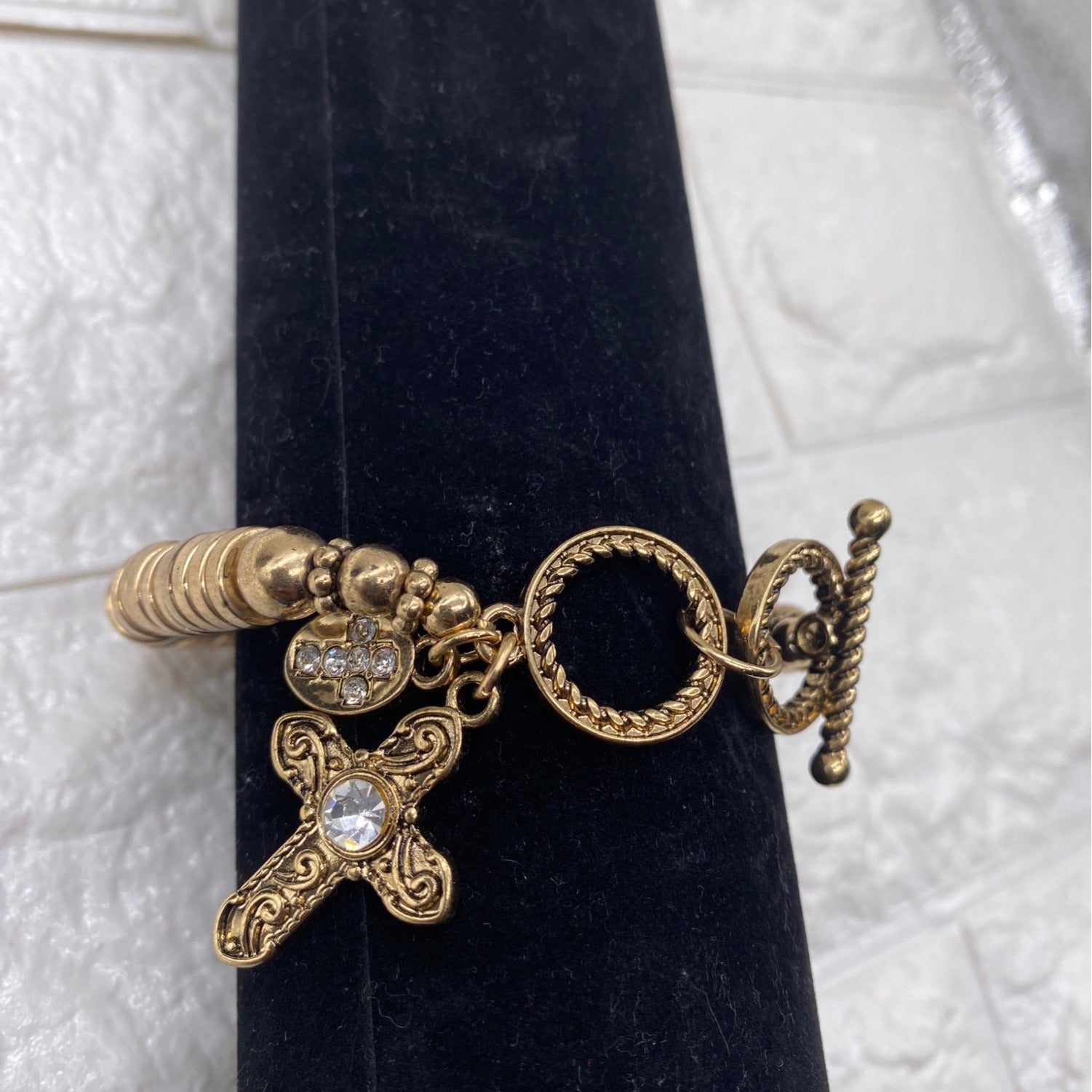 Gold Tone Cross Charm Stretch Bracelet With Toggle & Rhinestone Accents