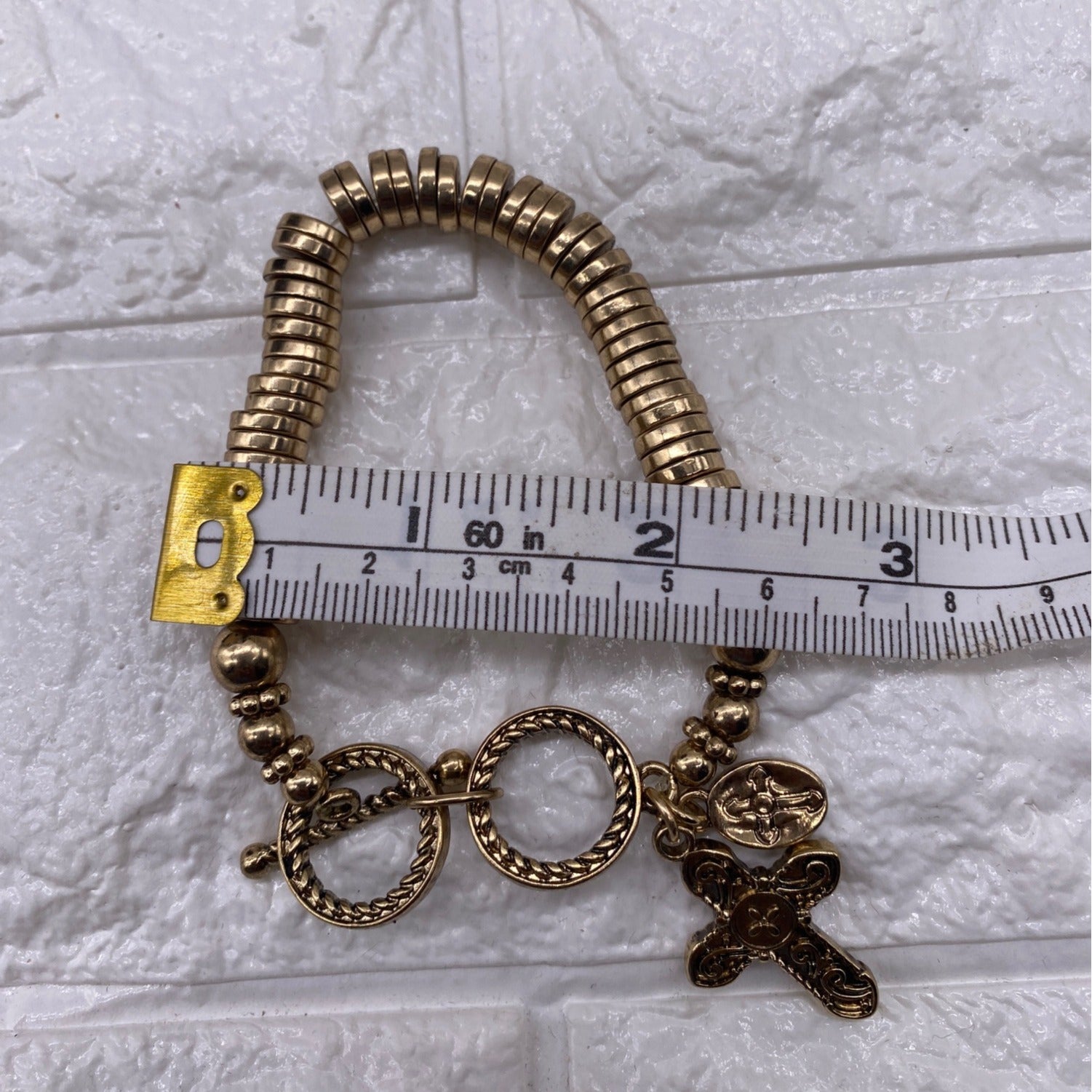 Gold Tone Cross Charm Stretch Bracelet With Toggle & Rhinestone Accents