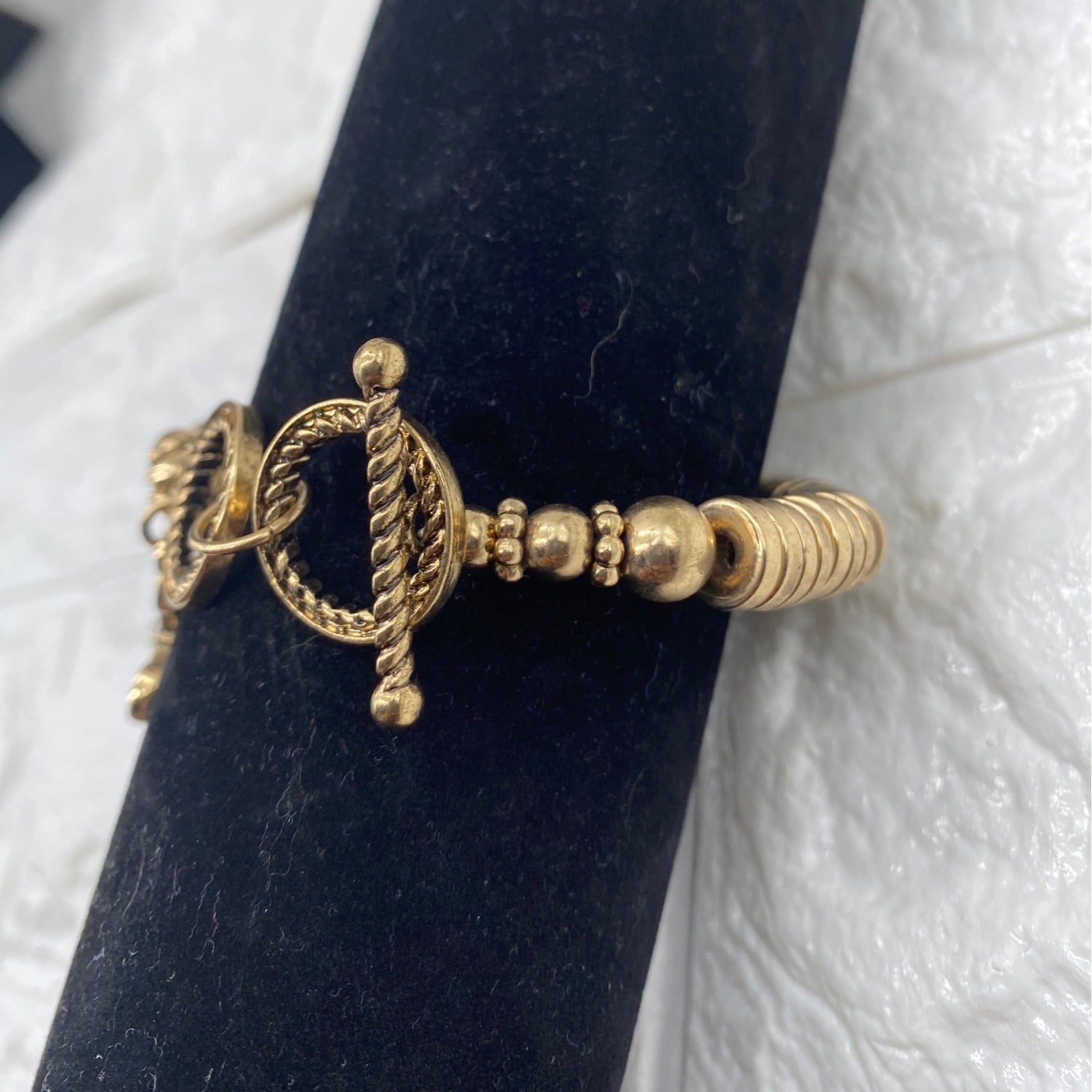 Gold Tone Cross Charm Stretch Bracelet With Toggle & Rhinestone Accents